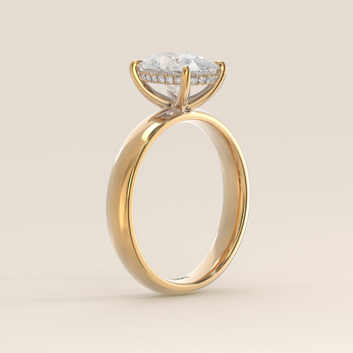 Verlovingsring ovaal lab grown diamant met brede band en hidden halo, geelgoud