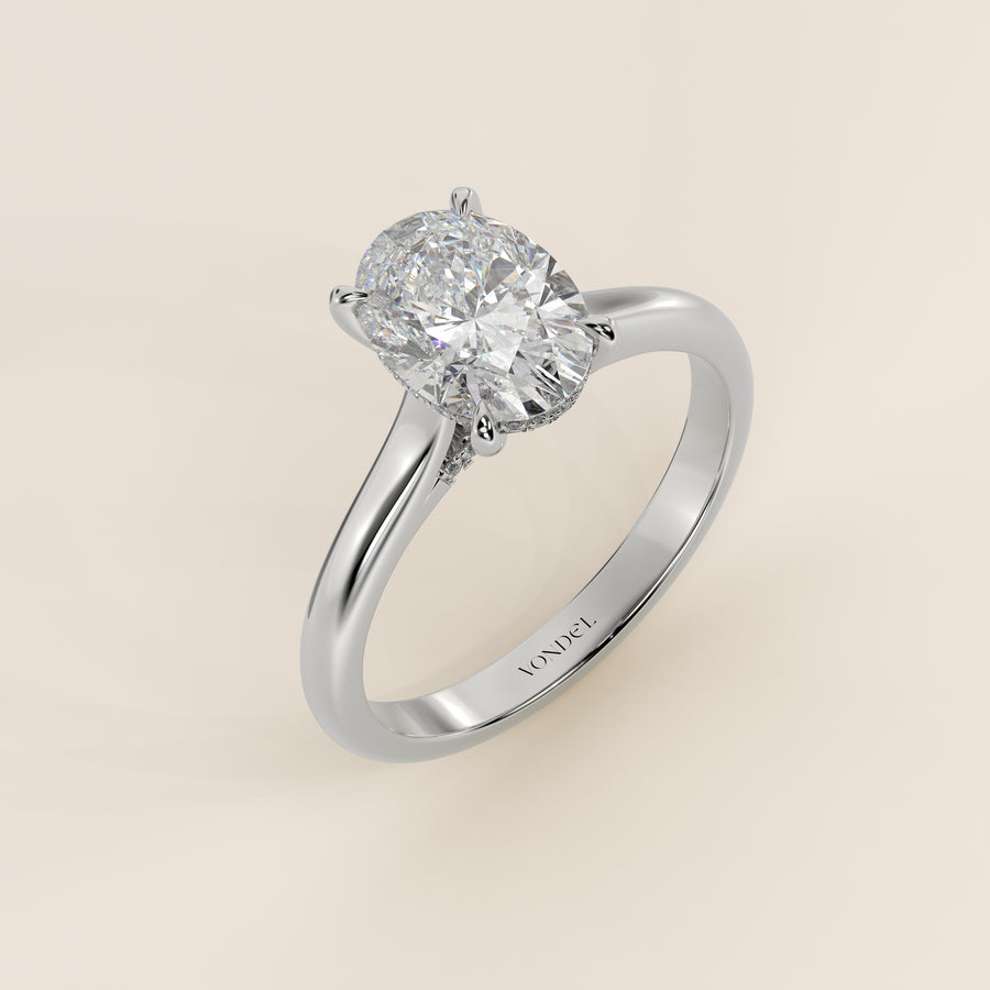 Verlovingsring ovaal lab grown diamant met cathedral setting, hidden halo en diamond bridge, witgoud