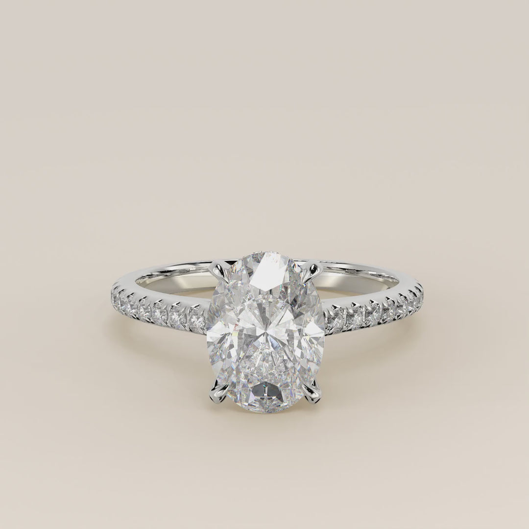 Verlovingsring ovaal lab grown diamant met cathedral zetting, pave band en hidden halo, witgoud