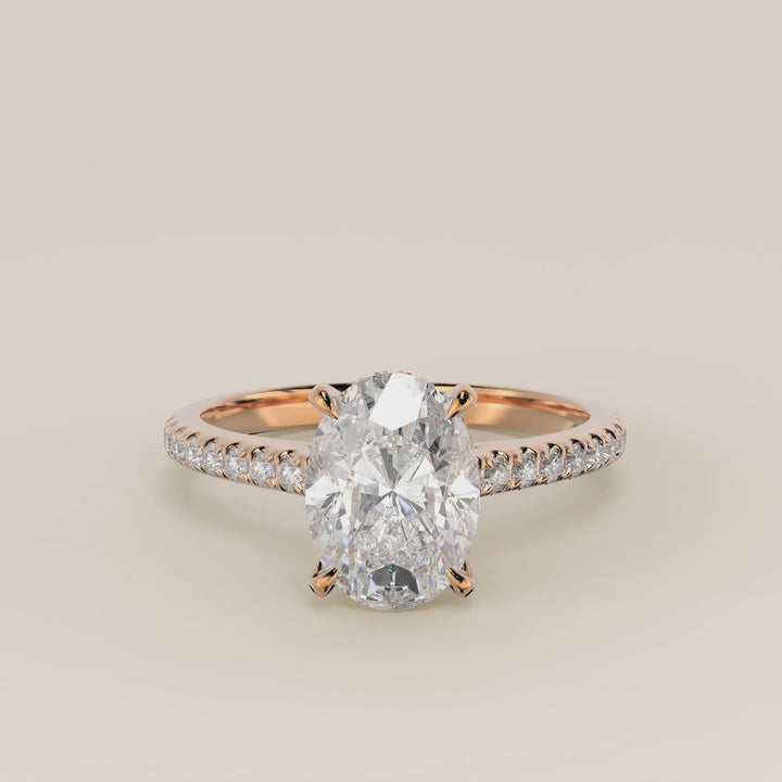 Verlovingsring ovaal lab grown diamant met cathedral zetting, pave band en hidden halo, rosegoud
